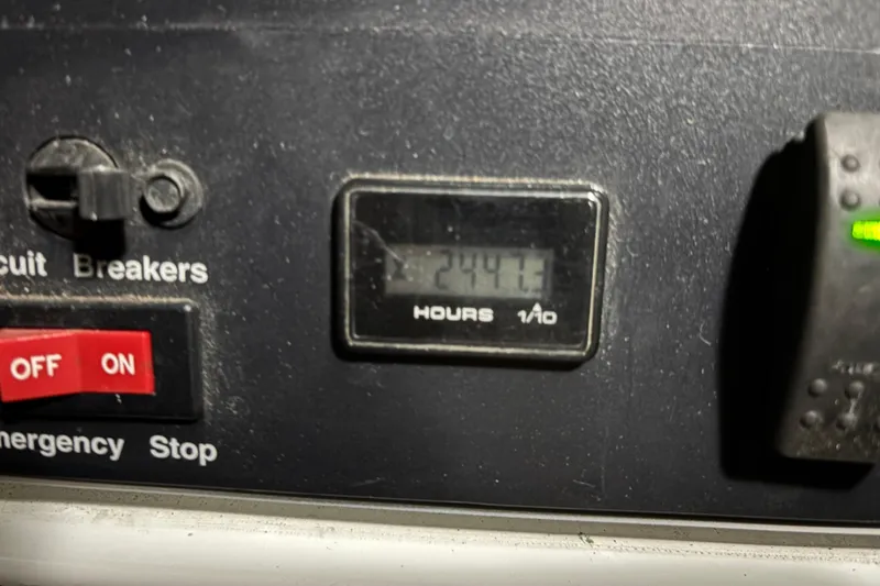 Slide: The Image of Forward Mechanical room of 2005 Cruisers Yachts 455 Express Motoryacht with equipment and wiring and Generator in Sound Shield. - 32