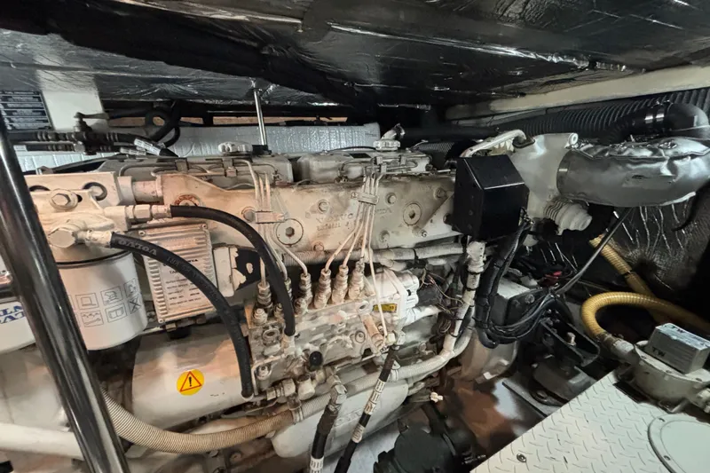 Slide: The Image of Engine compartment of a 2005 Cruisers Yachts 455 Express Motoryacht, showcasing detailed mechanical components. - 29