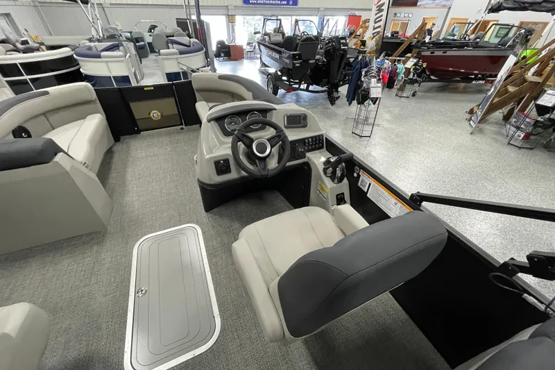 Slide: The Image of 2026 Barletta Sanza S22QC Tri pontoon boat interior with steering console and seating. - 14