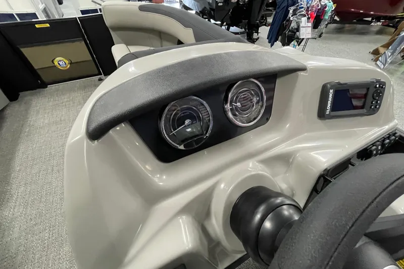 Slide: The Image of 2026 Barletta Sanza S22QC Tri dashboard with gauges and Lowrance display. - 15