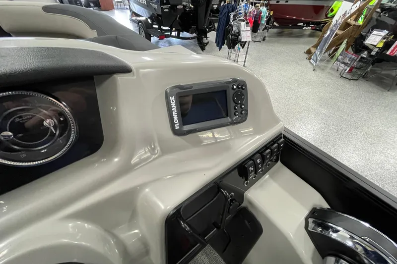 Slide: The Image of 2026 Barletta Sanza S22QC Tri boat dashboard with Lowrance display and controls. - 16