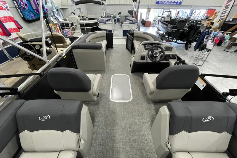 Slide: The Image of 2026 Barletta Sanza S22QC Tri pontoon boat interior with modern seating and steering console. - 9