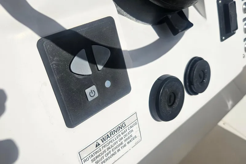 Slide: The Image of Control panel of a 2015 Intrepid 327 Center Console boat with warning label. - 25