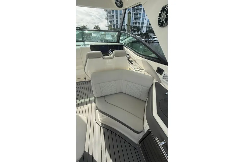 Slide: The Image of 2021 Sea Ray Sundancer 320 cockpit with luxurious seating and modern design. - 18