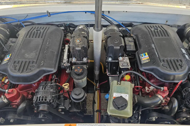 Slide: The Image of Twin engines of a 2008 Chris-Craft Launch 28 boat, showcasing detailed components. - 18