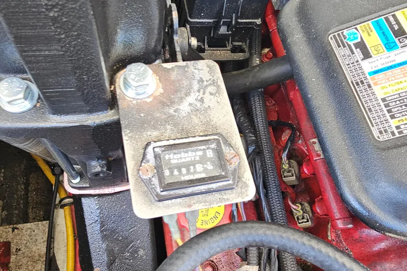 Slide: The Image of Engine compartment of 2008 Chris-Craft Launch 28 with hour meter and wiring details. - 21