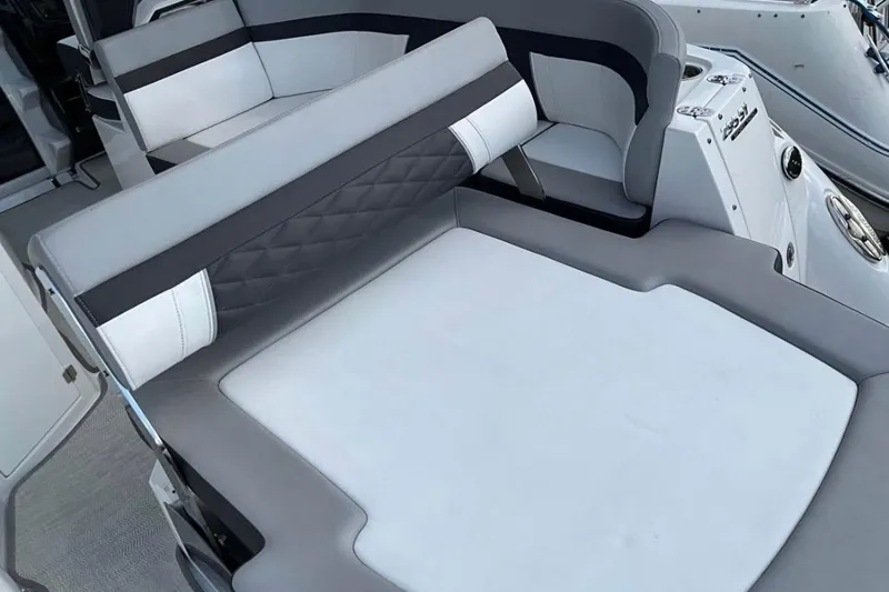 Slide: The Image of 2021 Monterey 295 Sport Yacht interior with sleek, modern seating and stylish upholstery. - 3