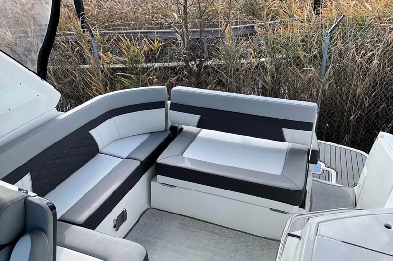 Slide: The Image of 2021 Monterey 295 Sport Yacht interior seating with modern design and comfortable upholstery. - 4