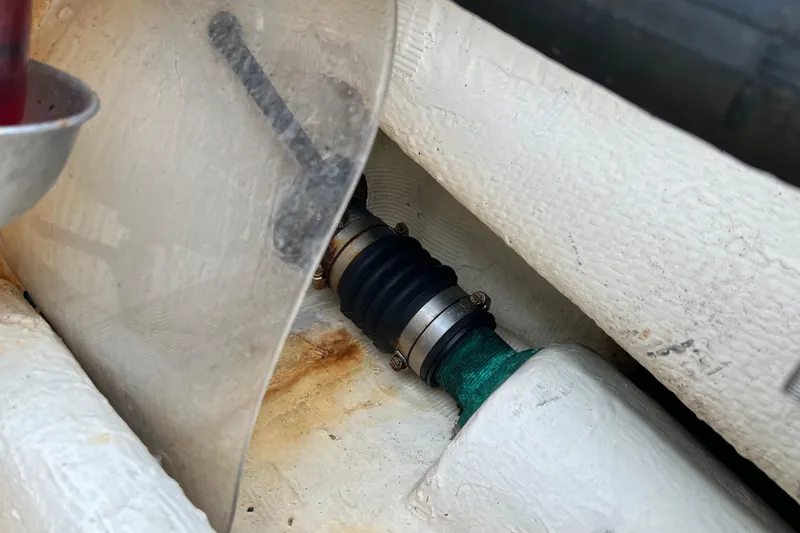 Slide: The Image of Close-up of a 1996 Henriques 28 Express boat's propeller shaft and coupling. - 13