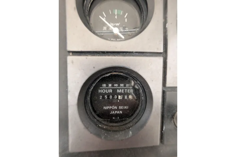 Slide: The Image of Hour meter reading 2500 hours on 1996 Henriques 28 Express boat dashboard. - 21