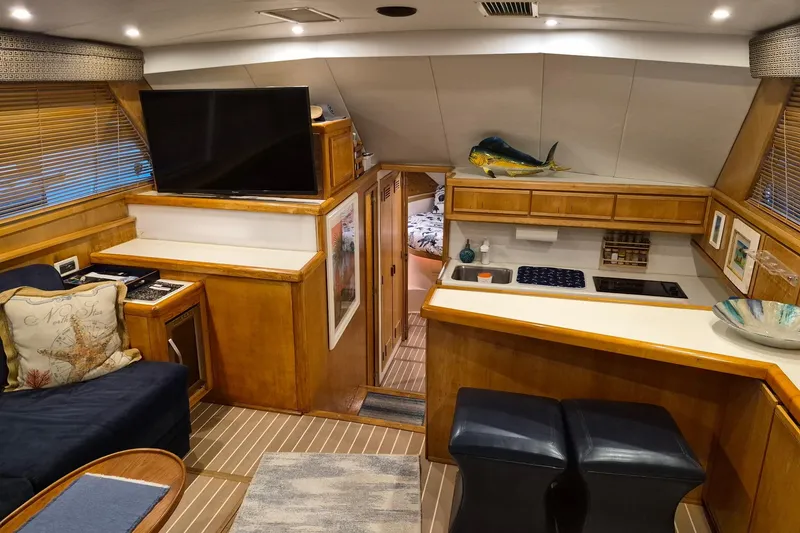 Slide: The Image of Interior of a 1995 Bertram 43 Convertible yacht with modern amenities. - 4