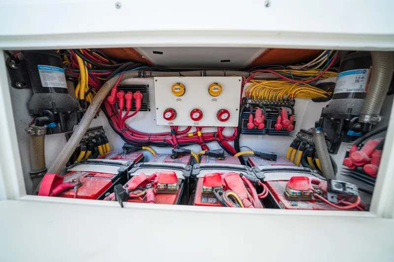 Slide: The Image of Electrical system of a 2016 Invincible 36 Open Fisherman boat, featuring batteries and wiring. - 14