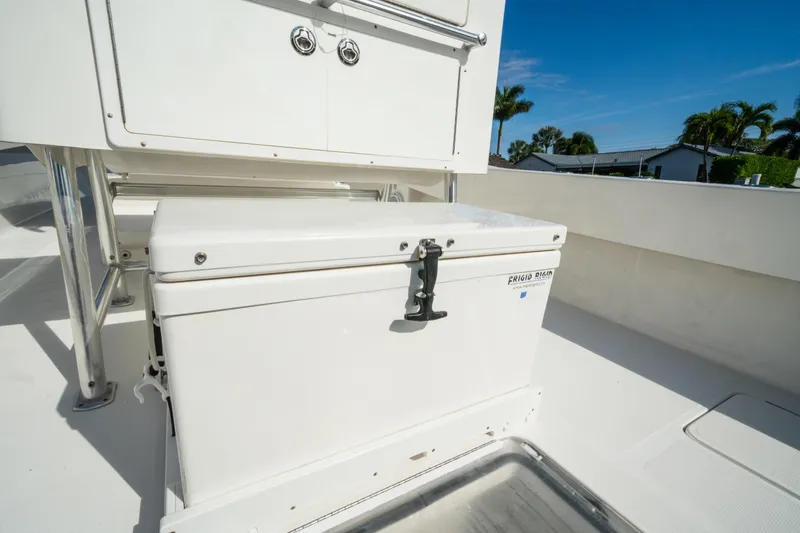 Slide: The Image of 2016 Invincible 36 Open Fisherman boat deck with storage compartment and cooler. - 19