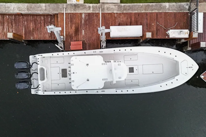 Slide: The Image of Overhead view of 2016 Invincible 36 Open Fisherman docked by wooden pier. - 2