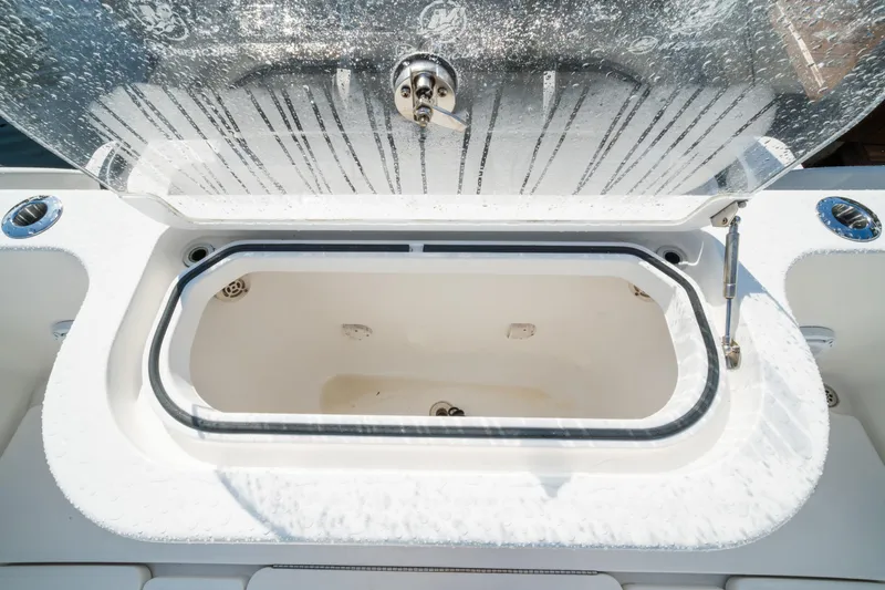 Slide: The Image of Open storage compartment on 2016 Invincible 36 Open Fisherman boat. - 21