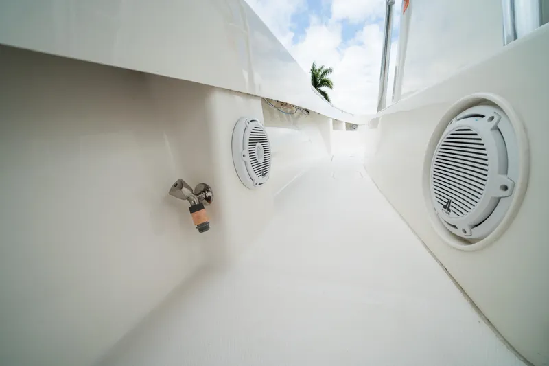 Slide: The Image of 2016 Invincible 36 Open Fisherman boat deck with speakers and faucet. - 23