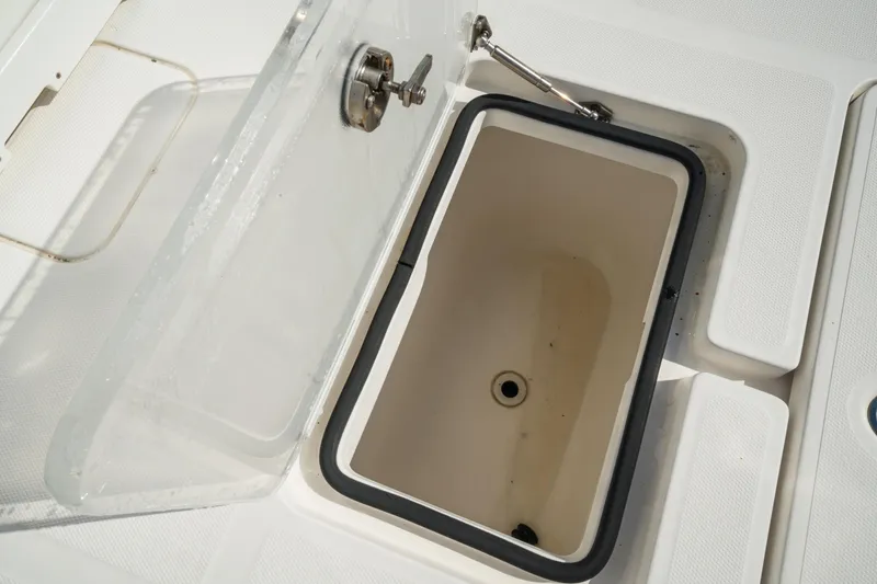 Slide: The Image of Open storage compartment on 2016 Invincible 36 Open Fisherman boat. - 24