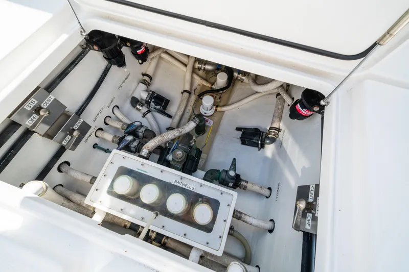 Slide: The Image of 2016 Invincible 36 Open Fisherman boat plumbing system with labeled valves and hoses. - 25
