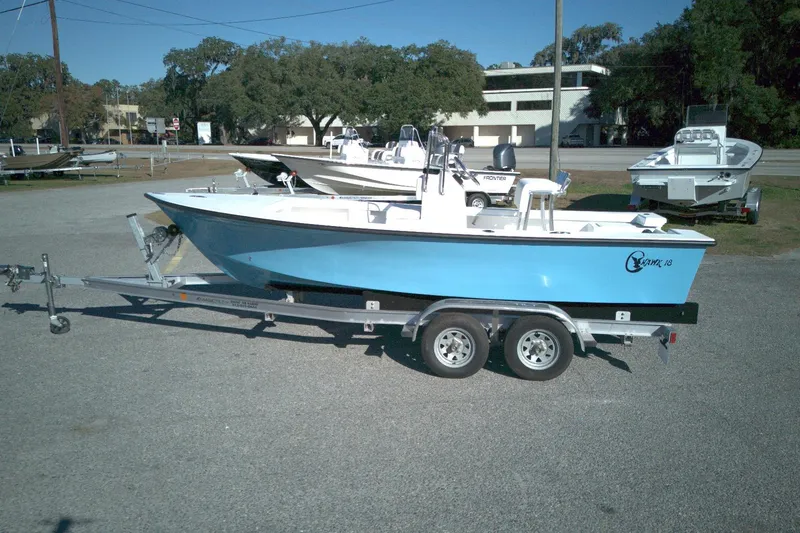 The Image of 2026 C-Hawk 18 Center Console boat on trailer in outdoor setting. - 0