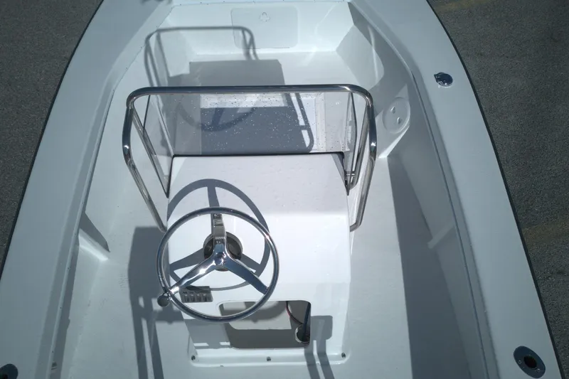 Slide: The Image of 2026 C-Hawk 18 Center Console boat interior with steering wheel and console. - 4