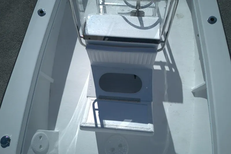 Slide: The Image of 2026 C-Hawk 18 Center Console boat interior with steering console and seating. - 7