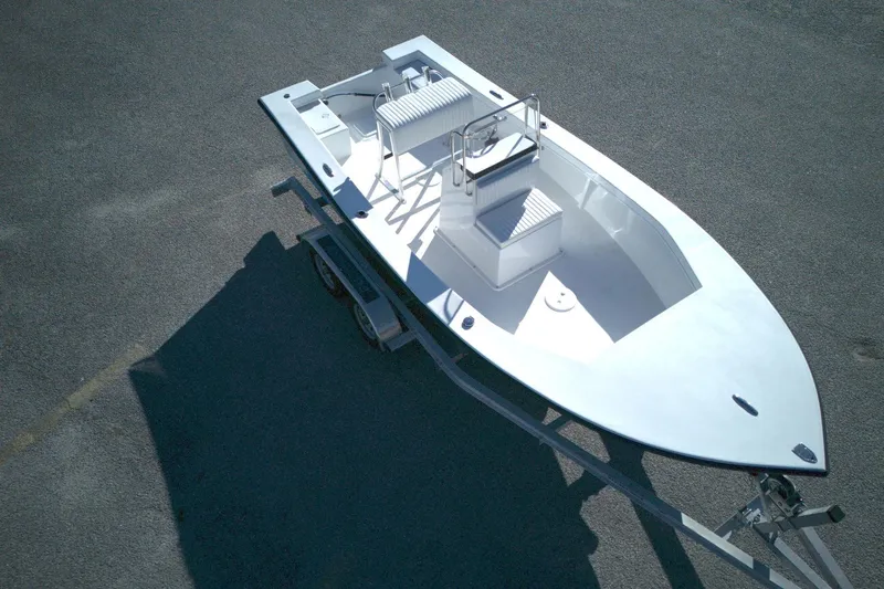 Slide: The Image of 2026 C-Hawk 18 Center Console boat on trailer, viewed from above. - 9