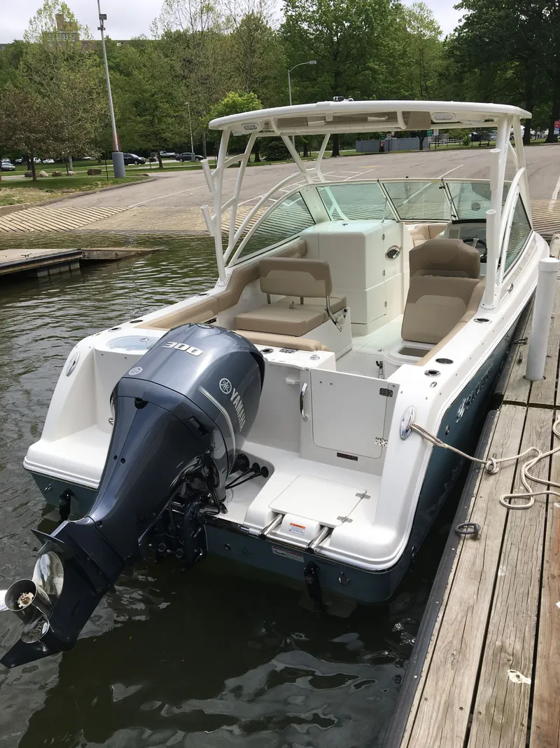 Slide: The Image of 2017 Sailfish 245 DC boat docked with Yamaha engine. - 8