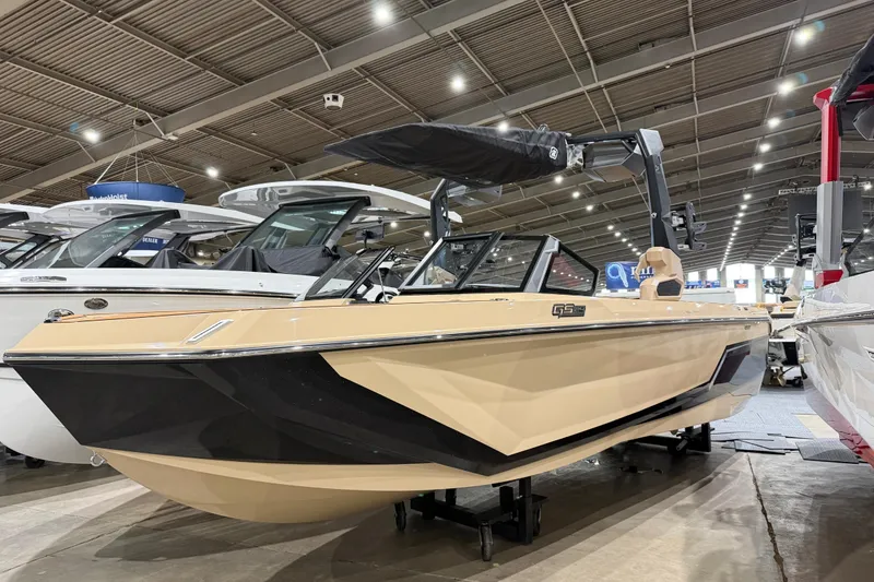 The Image of 2026 Nautique Super Air Nautique GS24 boat displayed at an indoor exhibition. - 0