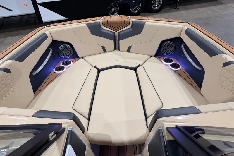 Slide: The Image of 2026 Nautique Super Air Nautique GS24 boat interior with luxurious seating and cup holders. - 8