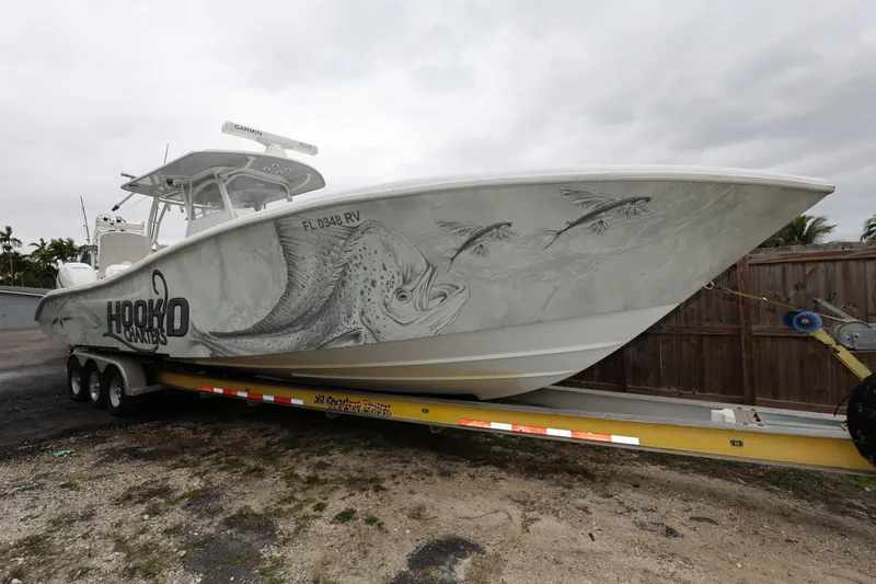Slide: The Image of 2017 Yellowfin 36 Offshore boat on trailer with custom fish artwork. - 1