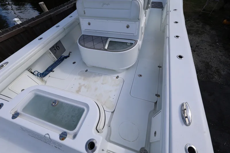 Slide: The Image of 2017 Yellowfin 36 Offshore boat interior with seating and storage compartments. - 10