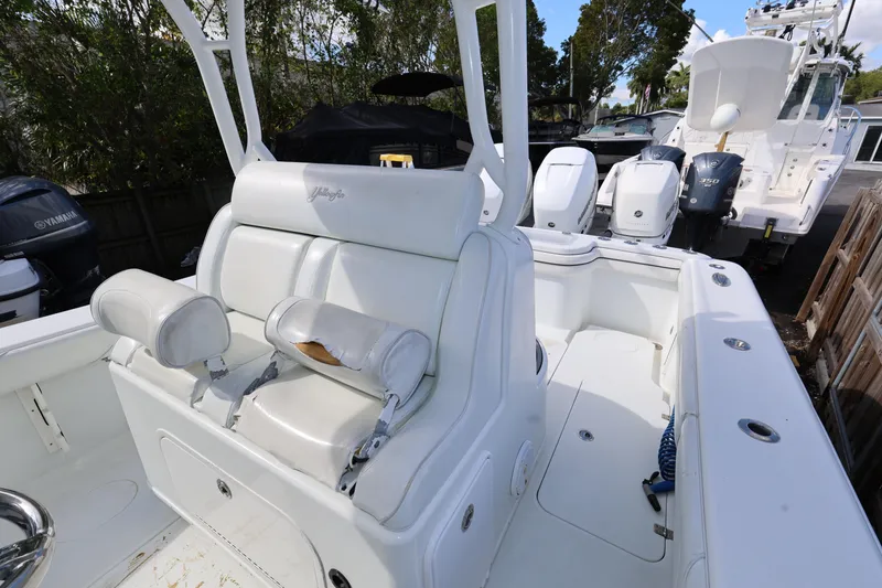 Slide: The Image of 2017 Yellowfin 36 Offshore boat interior with white seating and Yamaha engines. - 11