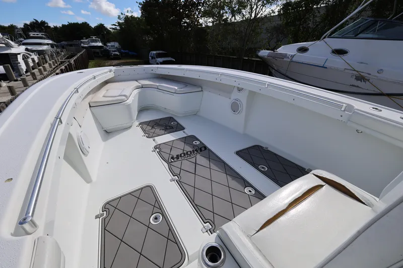 Slide: The Image of 2017 Yellowfin 36 Offshore boat interior with cushioned seating and non-slip flooring. - 13