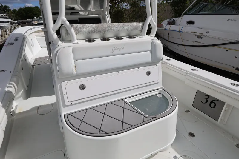 Slide: The Image of 2017 Yellowfin 36 Offshore boat interior with seating and storage compartments. - 19