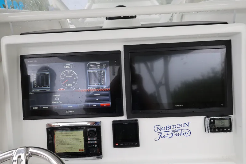 Slide: The Image of Dashboard of a 2017 Yellowfin 36 Offshore boat with Garmin displays. - 24
