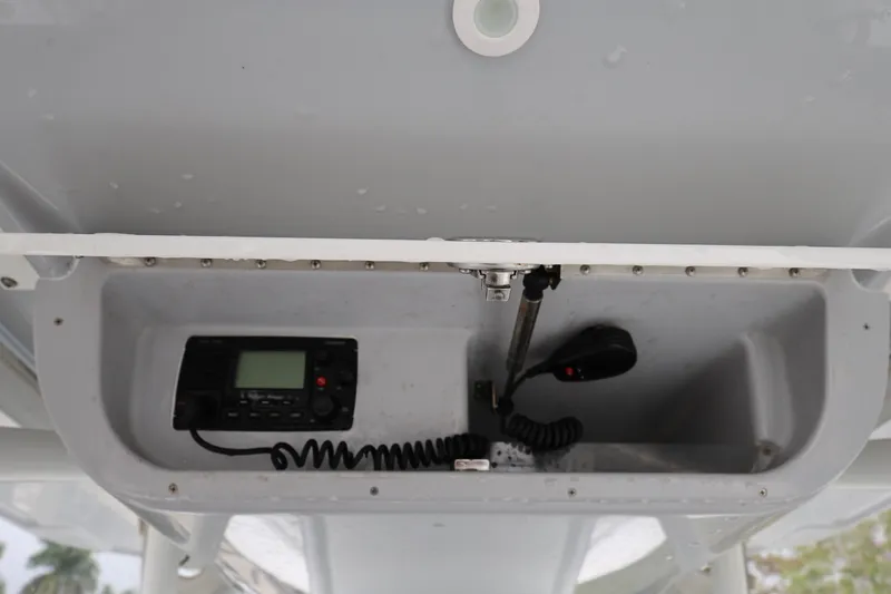 Slide: The Image of 2017 Yellowfin 36 Offshore boat radio compartment with communication equipment. - 25