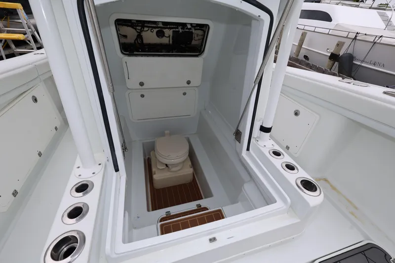 Slide: The Image of 2017 Yellowfin 36 Offshore boat interior with compact marine toilet. - 27
