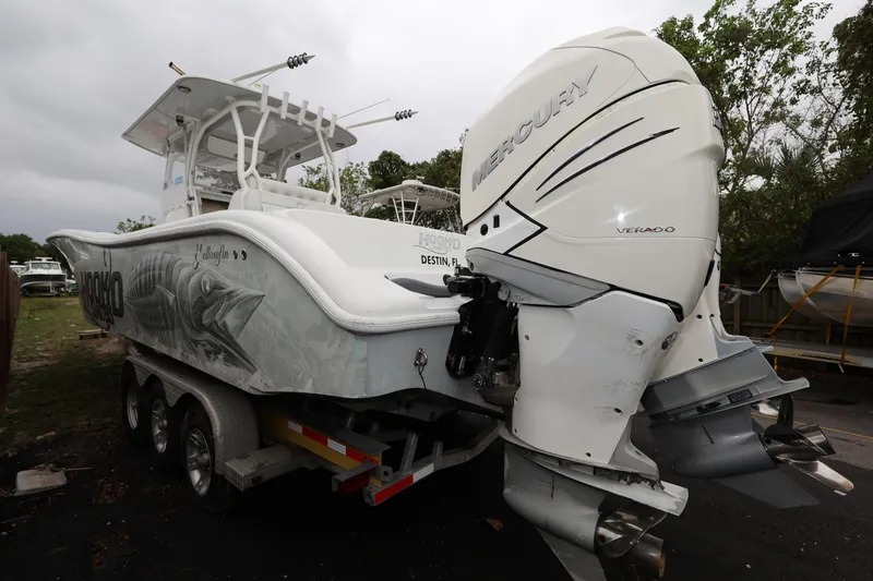 Slide: The Image of 2017 Yellowfin 36 Offshore boat with Mercury Verado engines, parked on a trailer. - 6