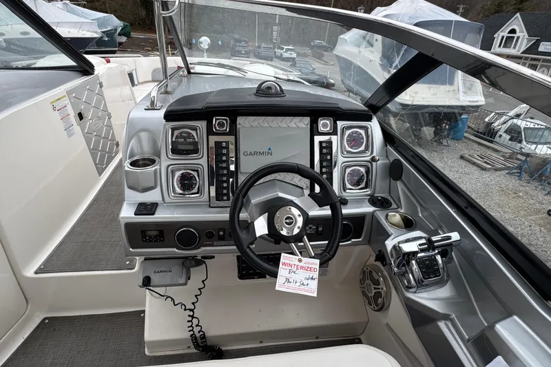 Slide: The Image of 2012 Chaparral 327 SSX boat dashboard with Garmin navigation system and controls. - 10