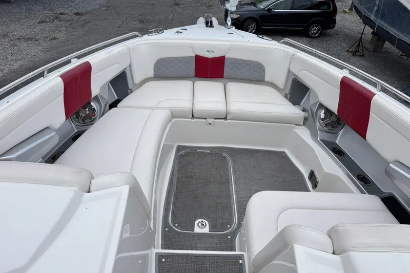 Slide: The Image of Luxurious seating area on a 2012 Chaparral 327 SSX boat with red accents. - 18