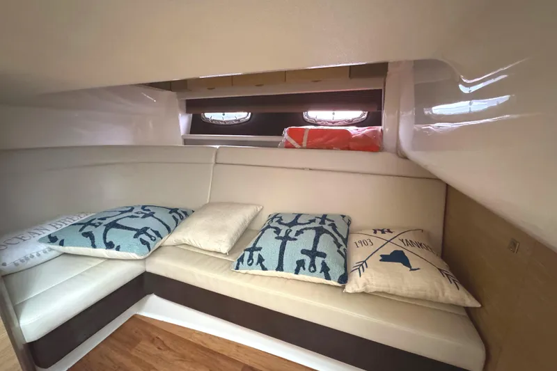 Slide: The Image of Interior of 2012 Chaparral 327 SSX boat with cozy seating and decorative pillows. - 25