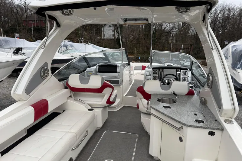 Slide: The Image of Interior of a 2012 Chaparral 327 SSX boat with luxurious seating and modern amenities. - 7