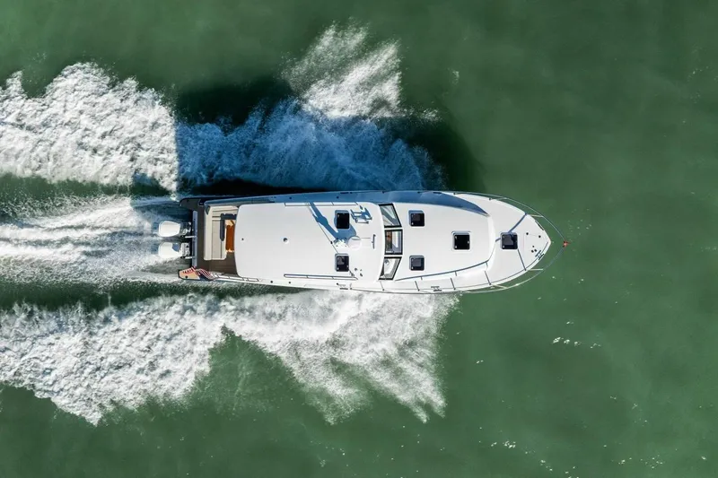 Slide: The Image of Aerial view of 2026 MJM 47R yacht cruising on open water. - 44