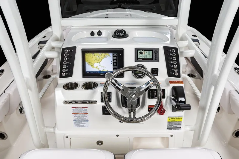Slide: The Image of Manufacturer Provided Image: 2022 Robalo 246 Cayman SD boat dashboard with navigation and control systems. - 10