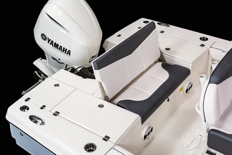 Slide: The Image of Manufacturer Provided Image: 2022 Robalo 246 Cayman SD boat with Yamaha engine, rear seating and storage compartments. - 18