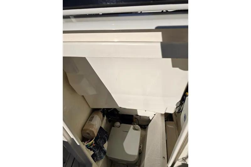 Slide: The Image of Interior view of 2022 Robalo 246 Cayman SD boat storage compartment. - 25