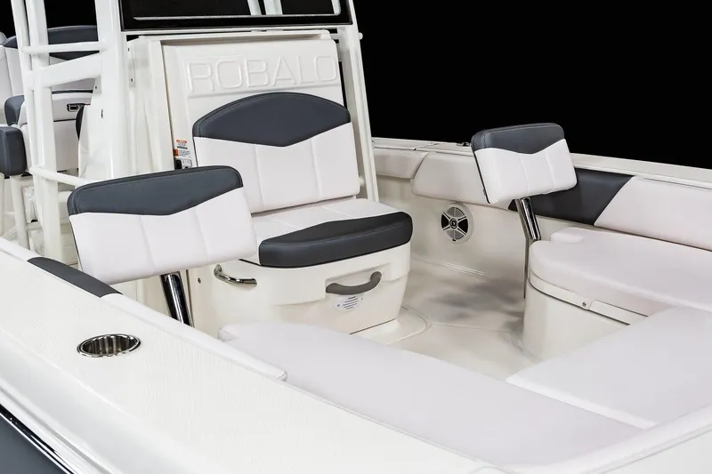 Slide: The Image of Manufacturer Provided Image: 2022 Robalo 246 Cayman SD boat interior with cushioned seating and storage compartments. - 6