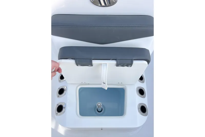 Slide: The Image of 2026 Robalo R160 Center Console boat seat with storage compartment open. - 10