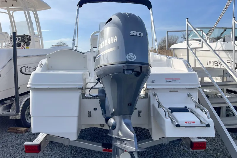 Slide: The Image of 2026 Robalo R160 Center Console boat with Yamaha 90 engine, rear view. - 11