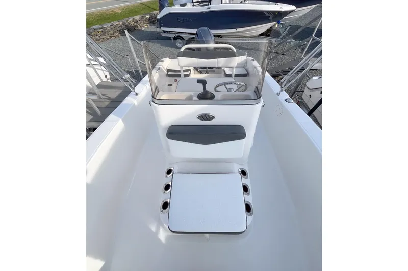 Slide: The Image of 2026 Robalo R160 Center Console boat interior with steering wheel and seating. - 9